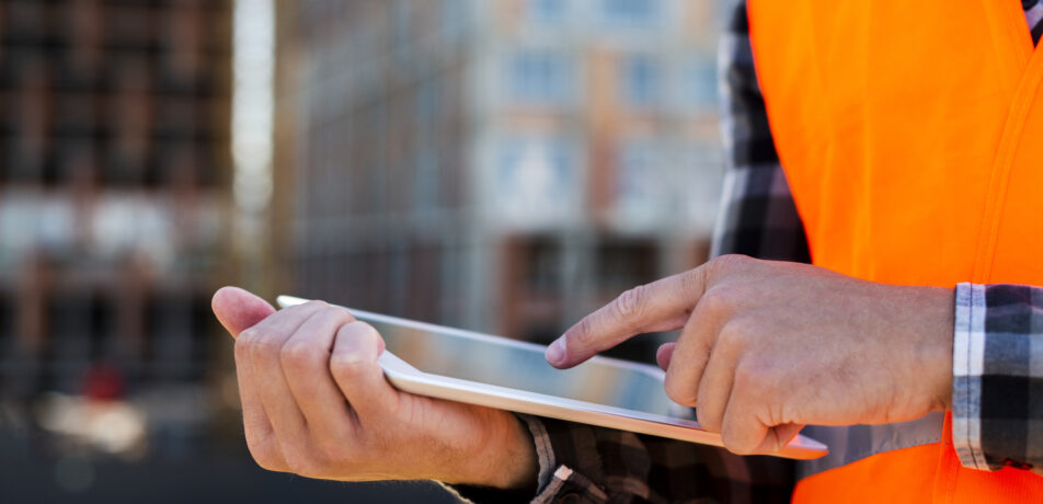 close-up-construction-engineer-using-tablet